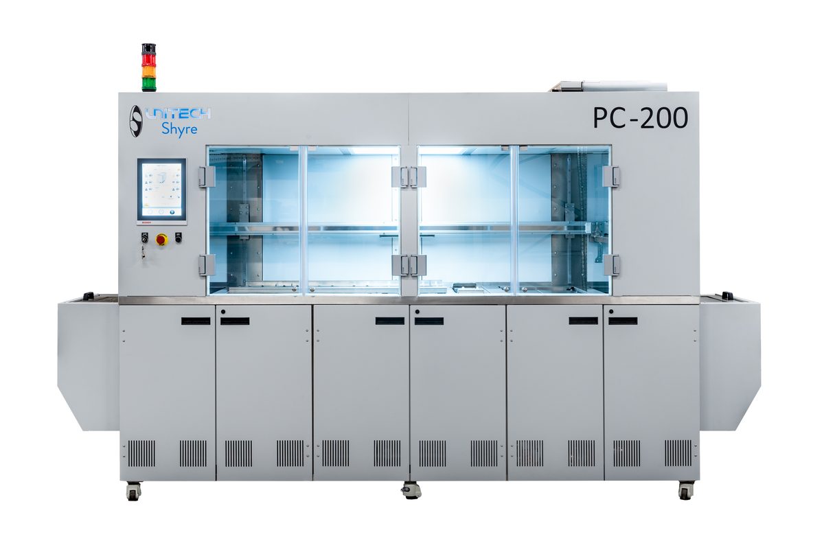 PC200 ultrasonic cleaning system with doors open showing lit interior tanks