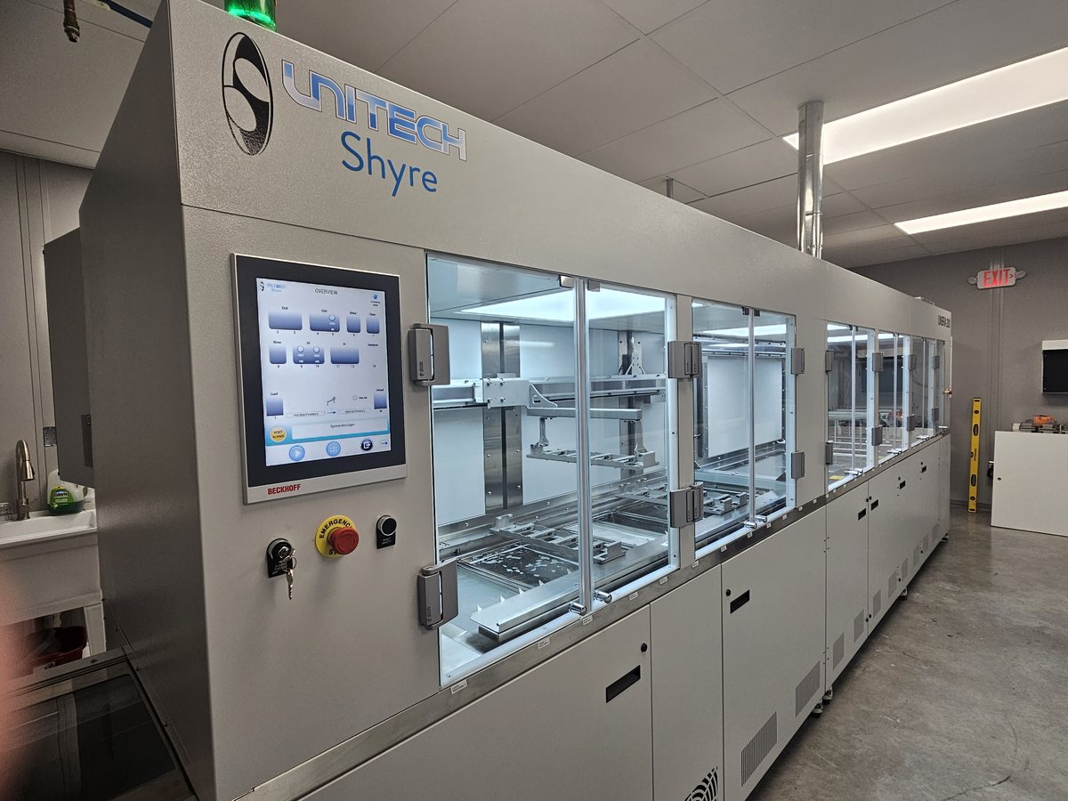 Unitech Shyre HC200 lens dip coating system installed on a production floor