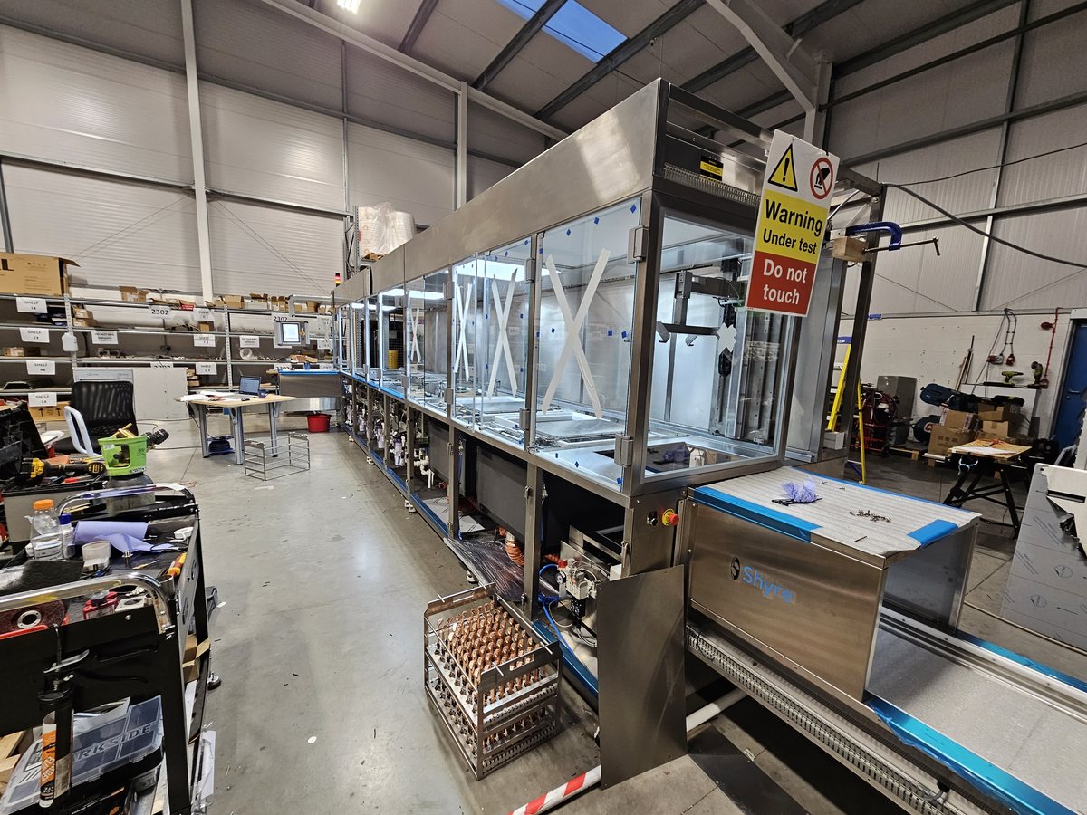 Unitech Shyre PC1400 large-scale metal finishing line for machined and pressed parts, degrease, brighten and passivate stages, installed at Interplex