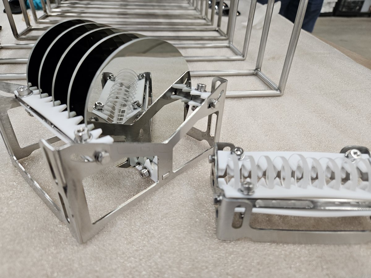 Polished infrared optics loaded in a cleaning jig inside a Unitech Shyre PC200 precision cleaning system