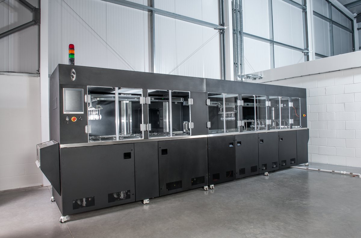Unitech Shyre HC200 dip coating line, full machine view showing the touchscreen control panel and the enclosed process chambers along the line